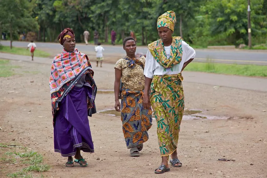 Women at a Tanzanian beach in modest clothing appropriate for Tanzania's conservative culture